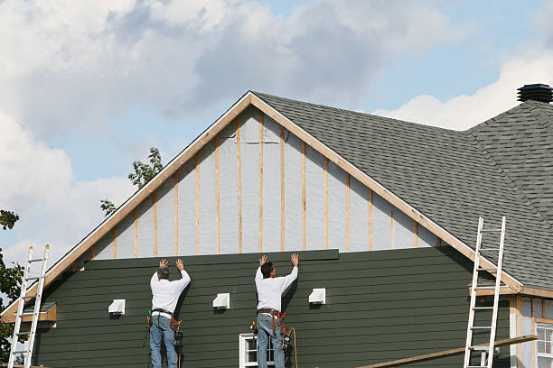 Professional Storm Damage Siding Repair technician working in Terrell, TX